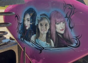 The tractor features artwork of Kaydence with characters from her favorite Disney Channel movie series