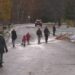 Marquette Trick-or-Treaters cross a street, 2024